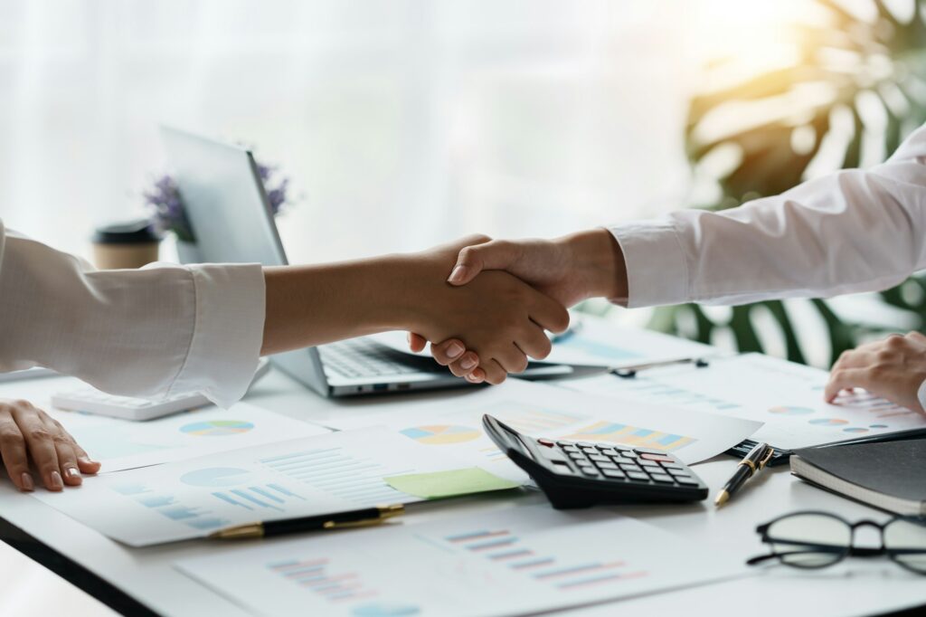 Business people join in congratulating them by แ in managing business in the organization. from join